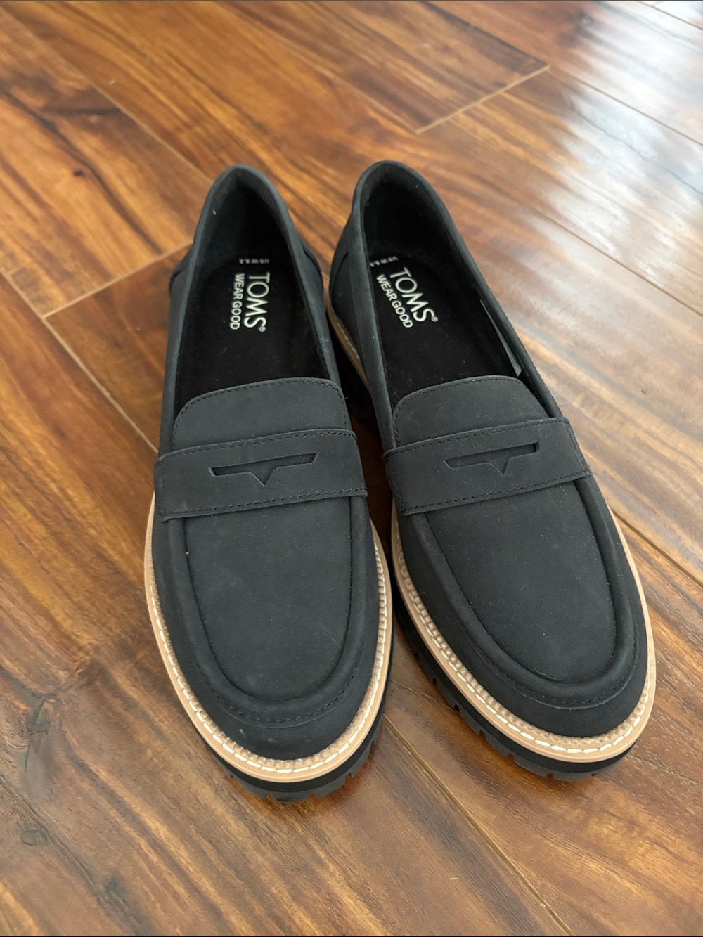 Toms Black Penny Loafers with Tan Trim